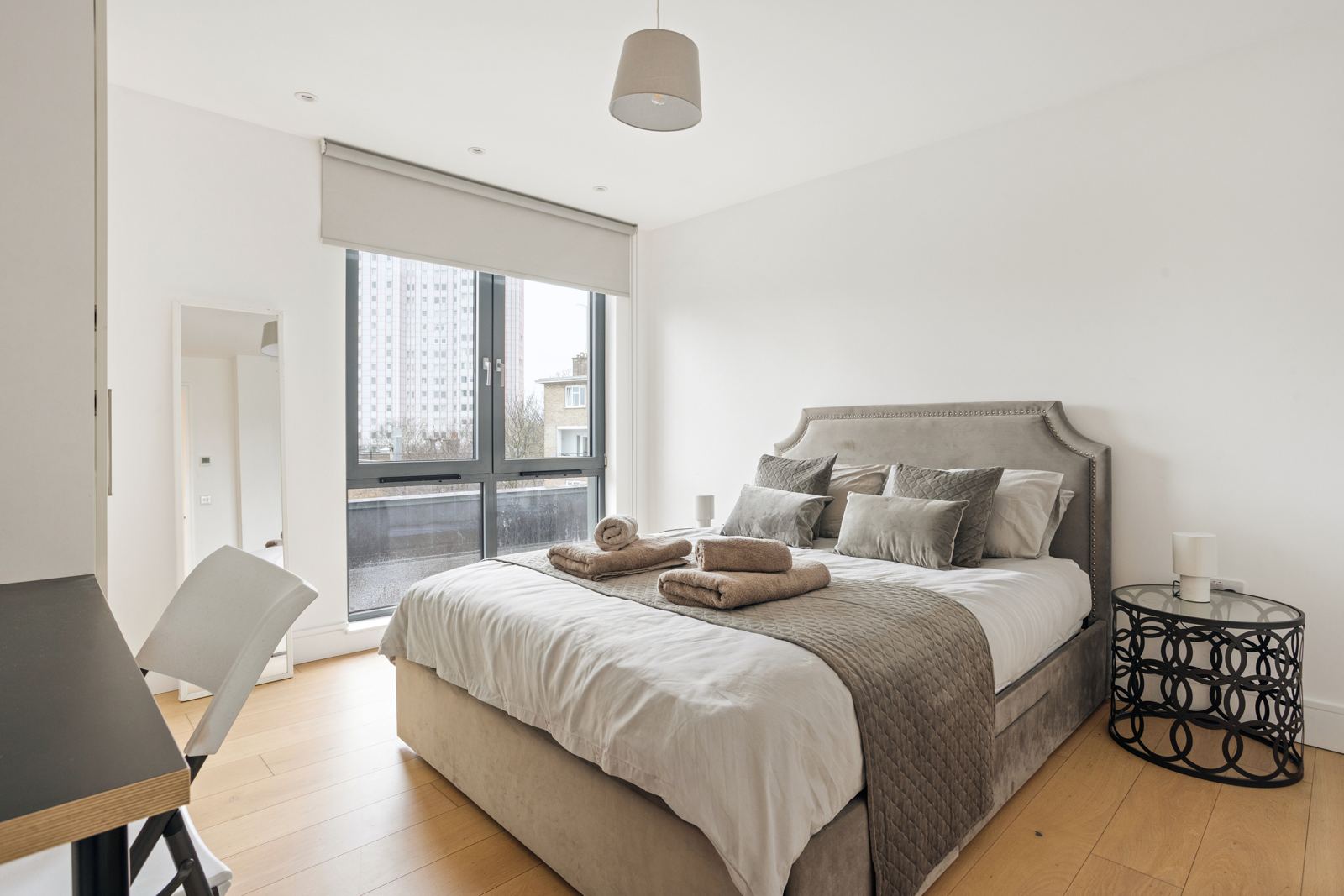 Bedroom with studded velvet headboard