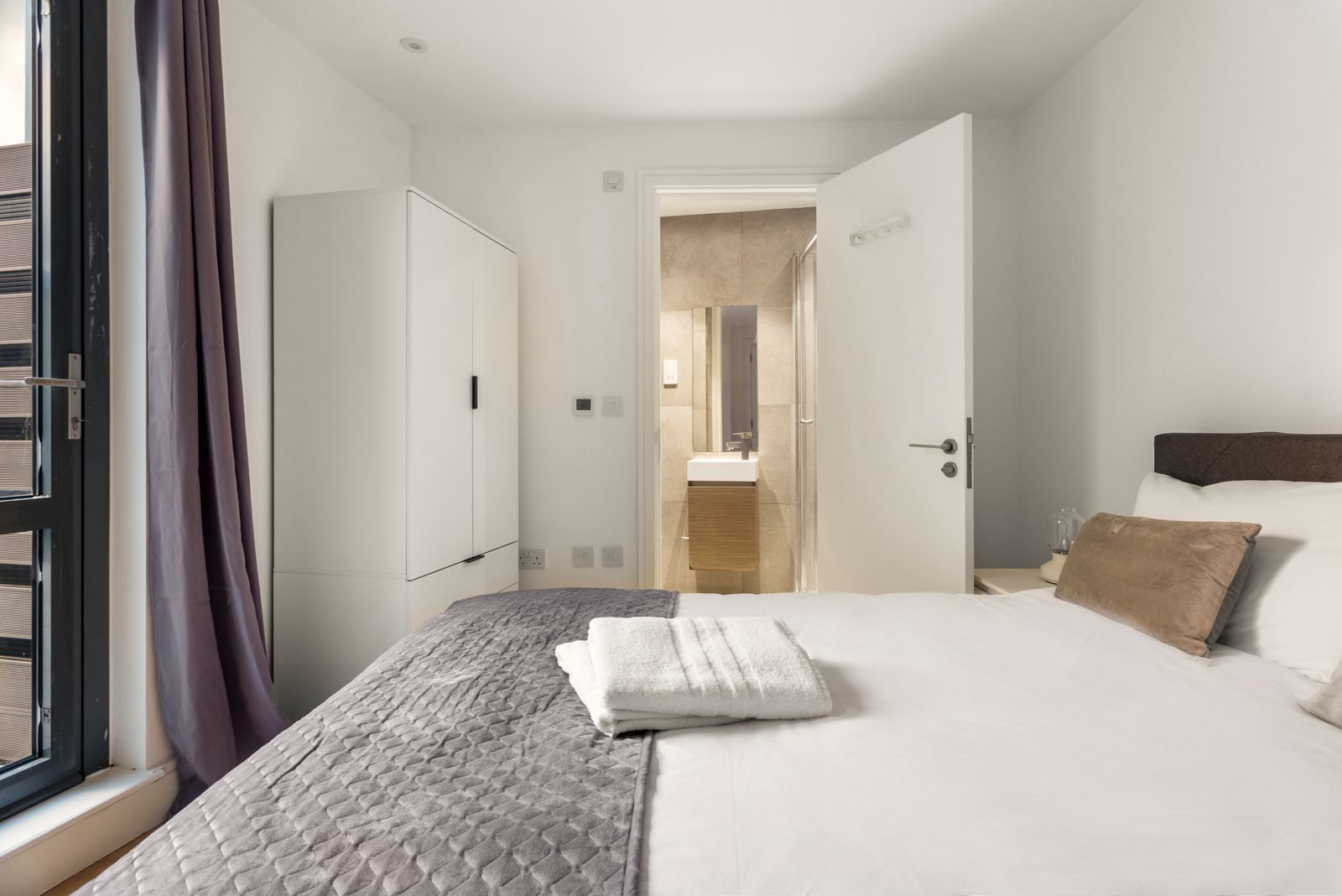 Bedroom with the en-suite door open