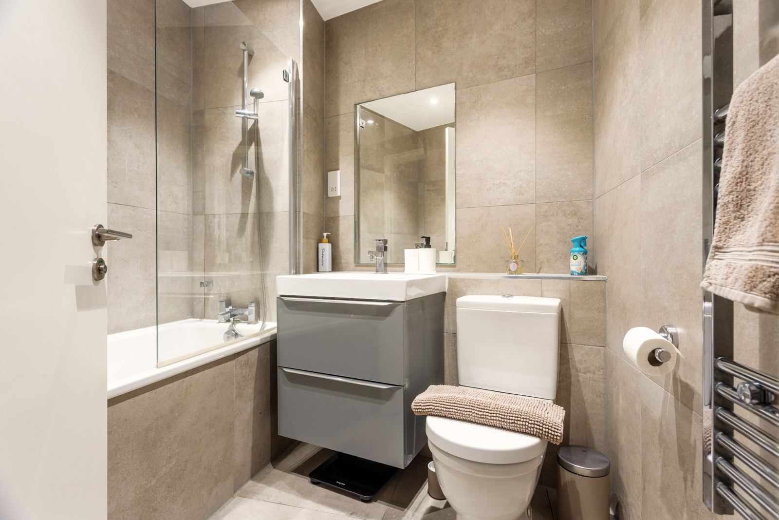 Bathroom with bath and heated towel rail